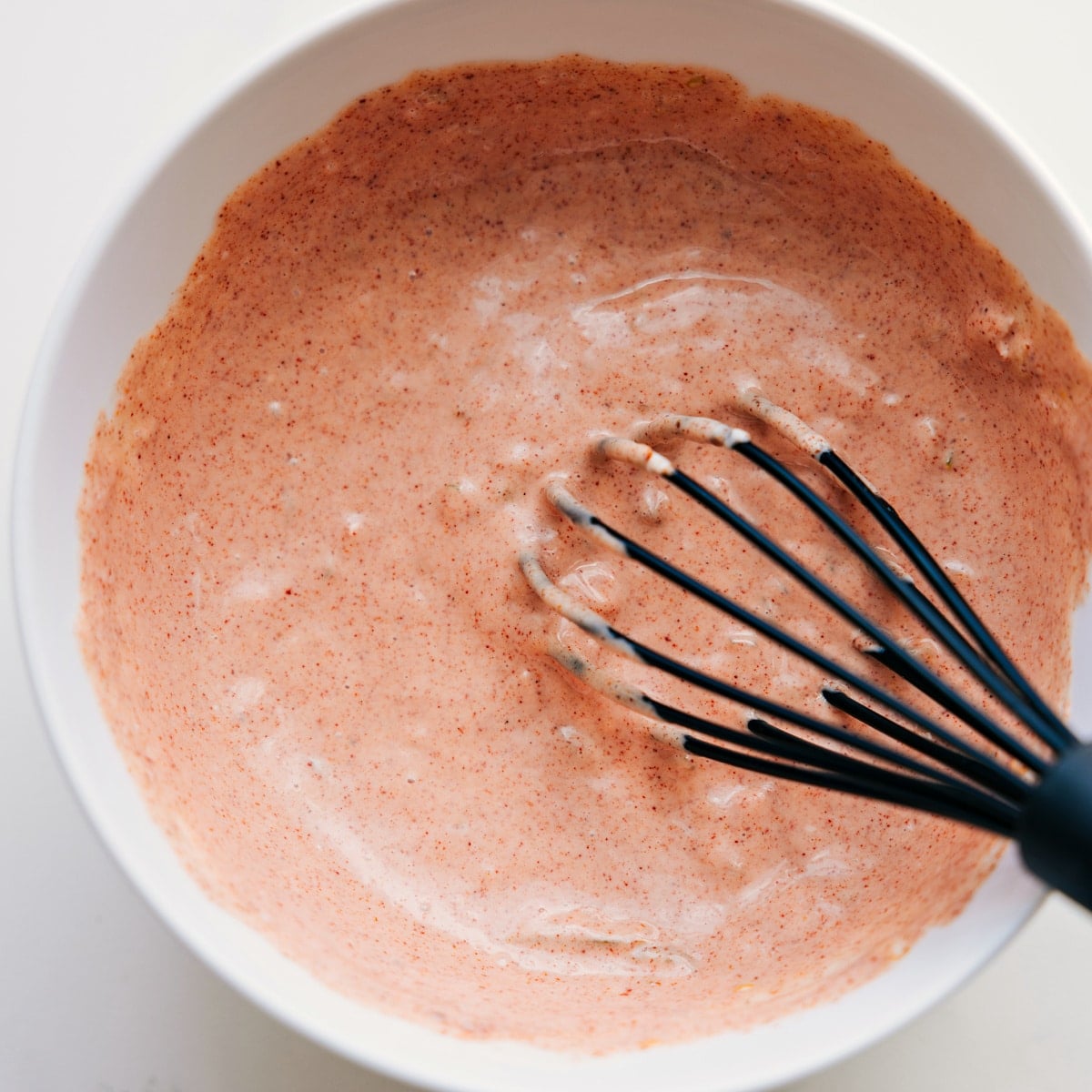 How To Make The Best Burger Sauce For These Burger Bowls Burger sauce being whisked together in a bowl, ready to top the burger bowls.