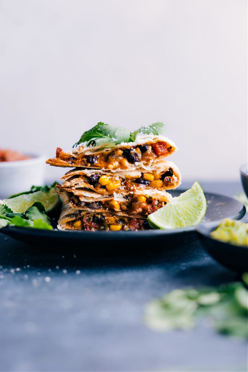 The Best Black Bean Quesadilla Recipe Made In Air Fryer Or Stove Top Black Bean Quesadillas cut and arranged on a plate.