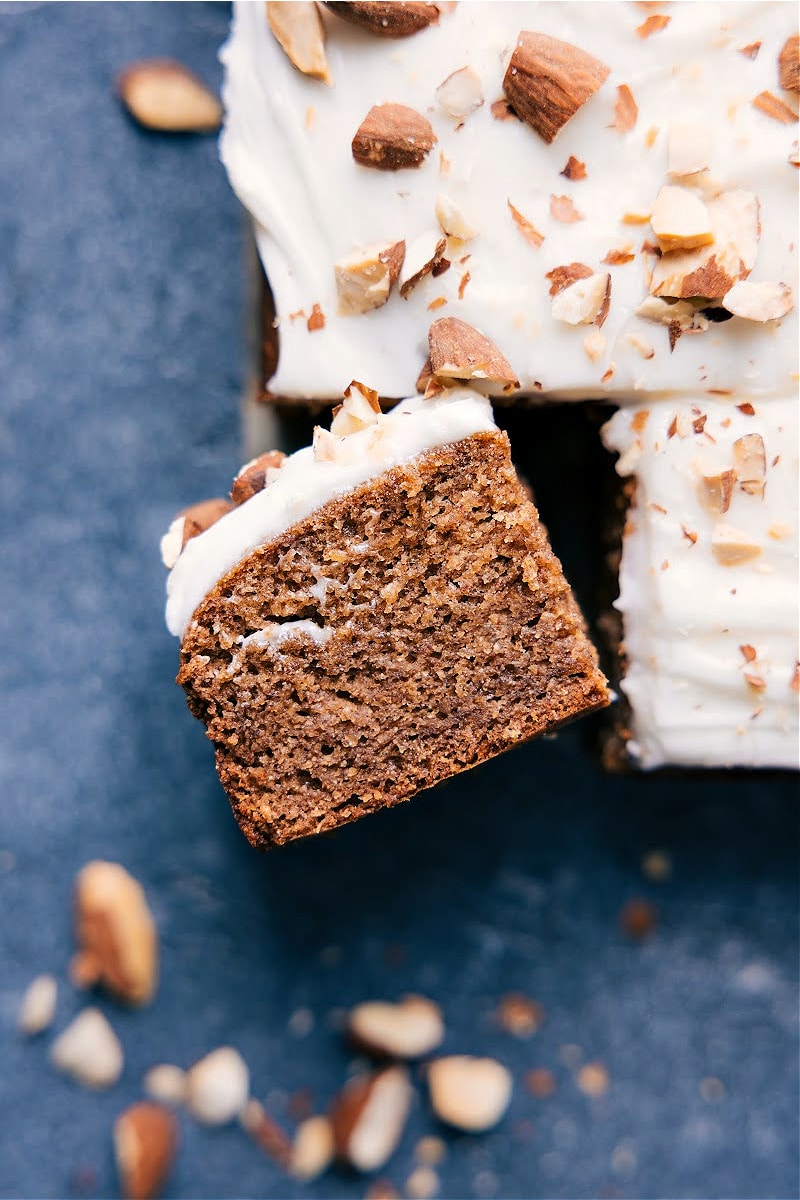 This Healthy Banana Cake Recipe is ultra moist, dense, and perfectly sweet! This cake is free of refined sugars, dairy, gluten, and flour -- but trust me, you won't be missing anything in this lush, delectable cake. Plus, we also include a recipe for an optional cream cheese frosting to top the cake with if you'd like! Recipe via ChelseasMessyApron.com #bananacake #healthy #creamcheesefrosting #almonds #nutritious #glutenfree Healthy Banana Cake