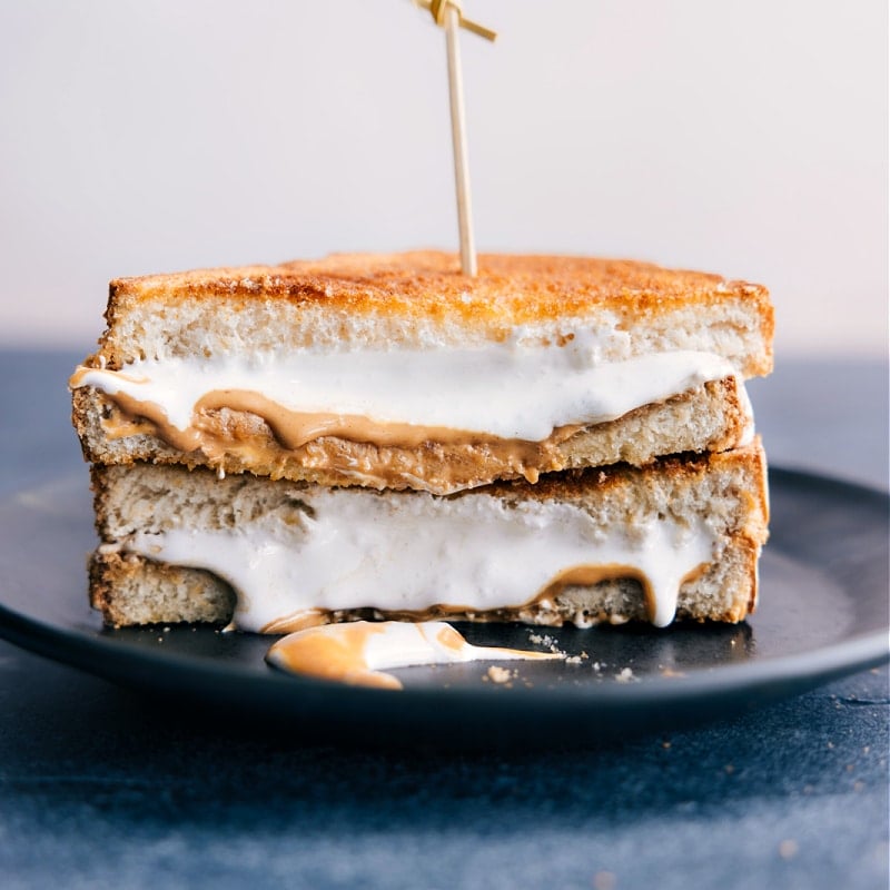 Does anything beat a good peanut butter and jelly? Yes -- an air-fried peanut butter and jelly! Recipe via chelseasmessyarpon.com #dessert #quick #easy #simple #best #afterschoolsnack #airfryer #sandwich Image of the Air Fryer Sandwich-- peanut butter and marshmallow fluff version