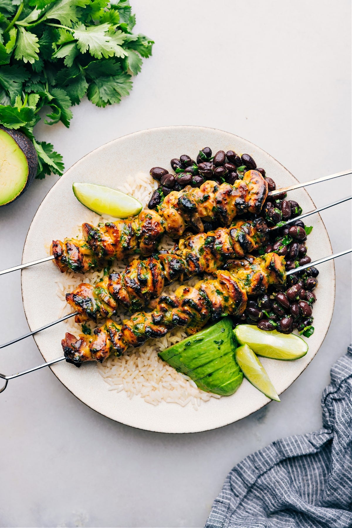 The Best Citrus Chicken Marinade Citrus Chicken Marinade on a plate over rice.