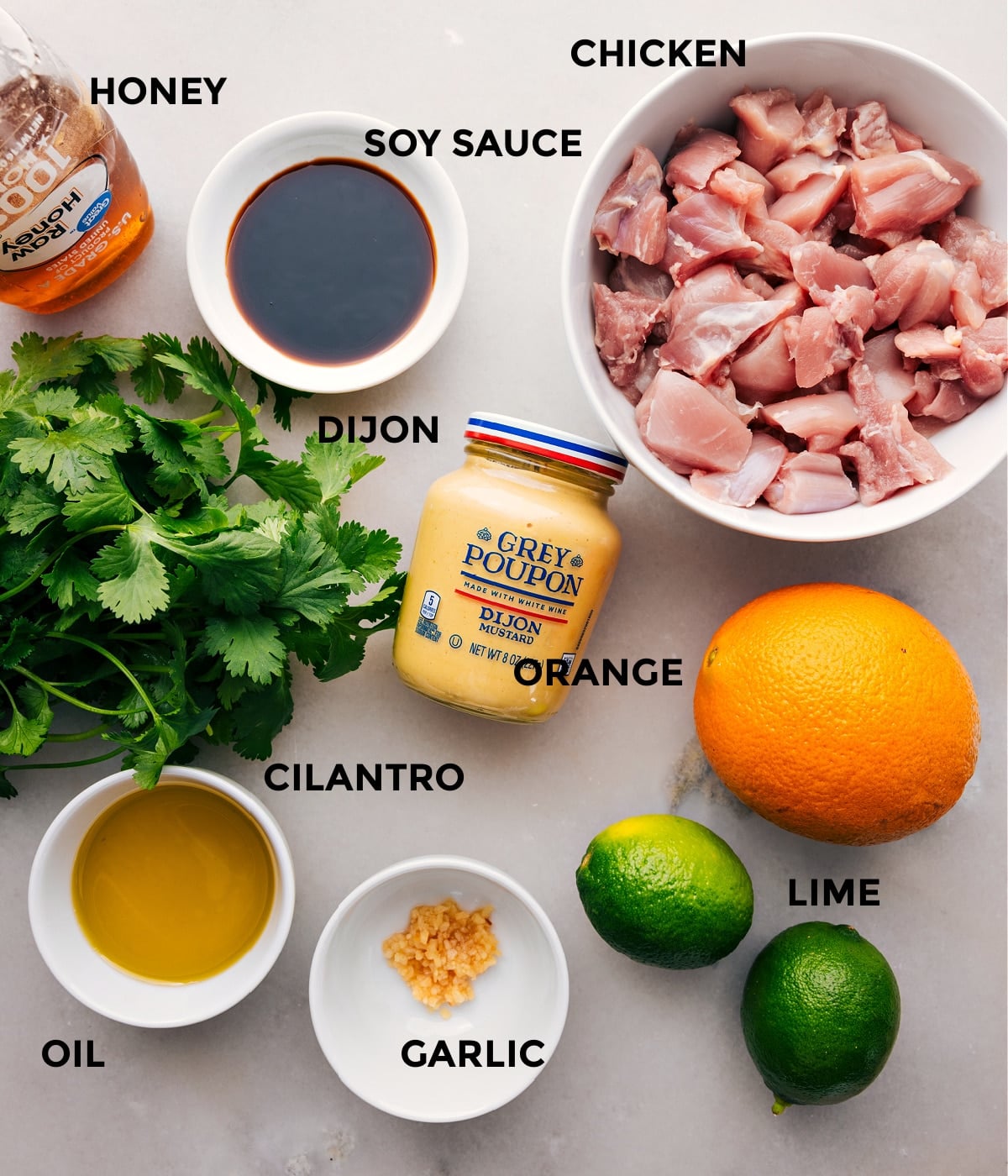 Ingredients In Citrus Chicken Marinade All the ingredients for this recipe are prepped and ready to goโincluding the meat, soy sauce, honey, Dijon, orange, cilantro, garlic, and limeโfor easy assembly.