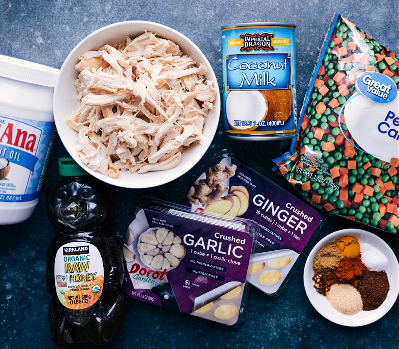 This simple and flavorful Garam Masala Chicken can be ready in 20 minutes or less. We combine chicken, peas, and carrots in a blend of spectacular spices and coconut milk. Recipe via ChelseasMessyApron.com #indian #garammasala #chicken #withrice #naan #coconutmilk #backtoschool Ingredient shot of elements used in Garam Masala Chicken