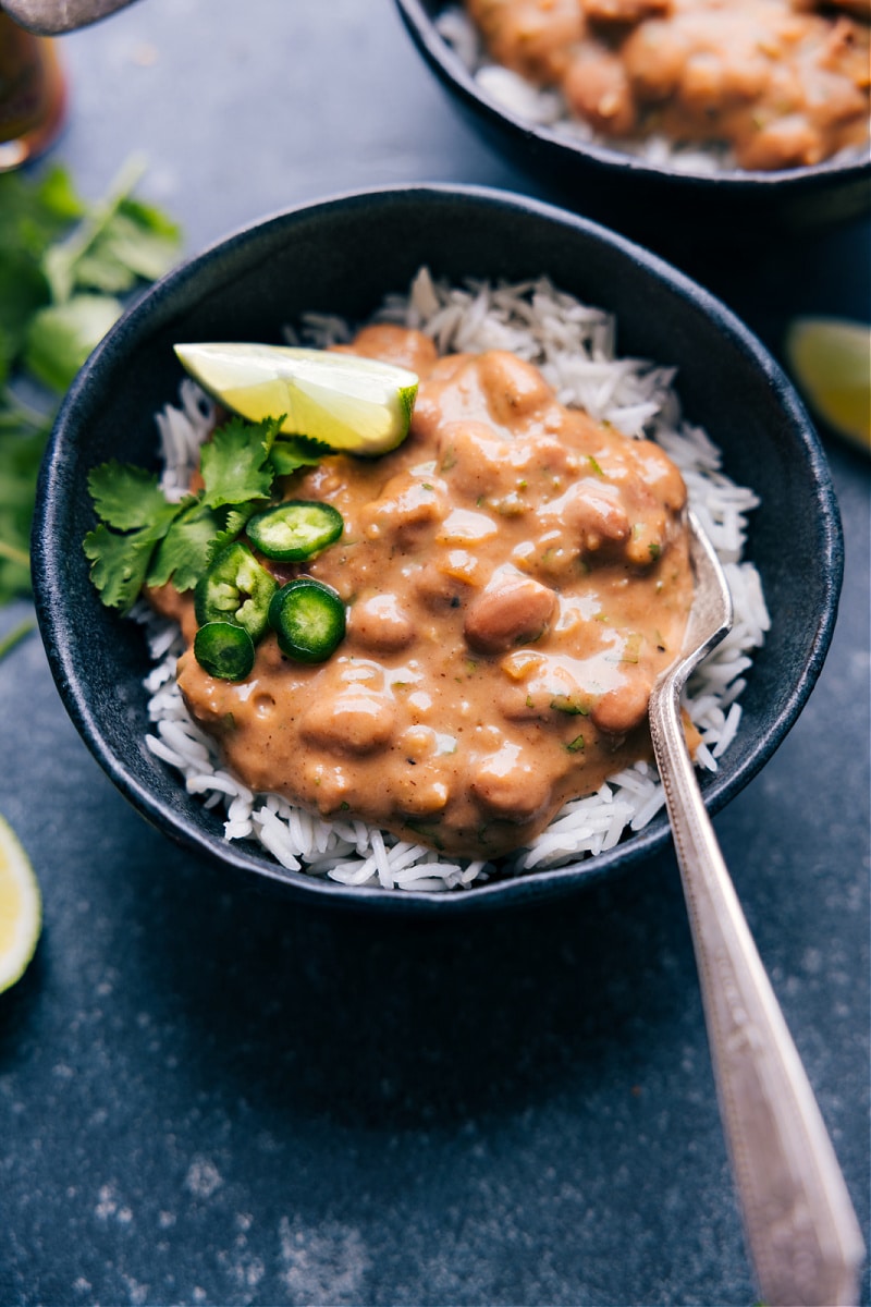 Savory Rice And Beans is a quick 20-minute meal that is hearty, filling, and vegetarian! Recipe via ChelseasMessyApron #dinner #quick #easy #simple #best #fresh #familyfriendly #kidfriendly #vegetarian #riceandbeans Overhead image of Rice and Beans