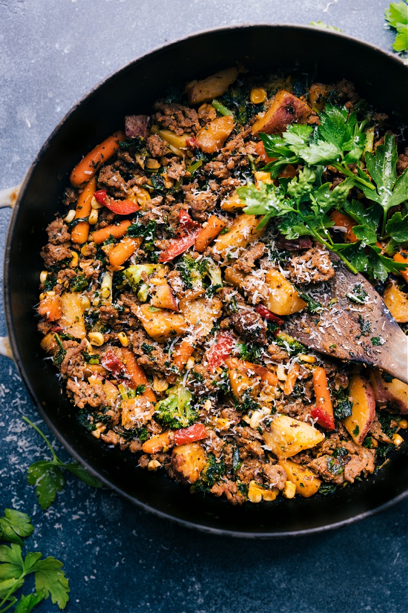 This Sausage And Veggie Skillet is unbelievably easy (thanks to frozen veggies) while being loaded with flavor (thanks to an incredible spice blend)! Recipe via ChelseasMessyApron.com #sausageskillet #quickeasy #backtoschool #lifesaver #veggies Overhead view of Sausage and Veggie Skillet