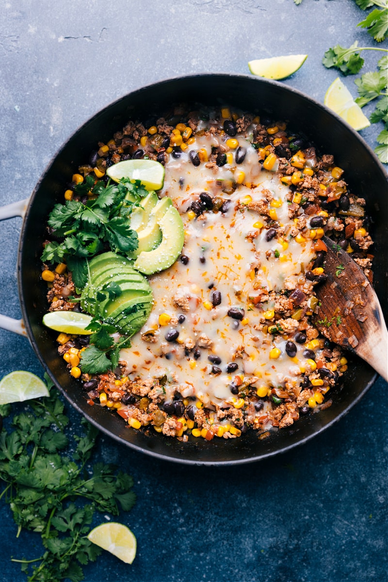This delicious Green Chile Ground Turkey is an explosion of flavor! Well-seasoned ground turkey with savory black beans, crisp corn, and a saucy fire-roasted green chiles base. Easy, 30-minute (or less) weeknight meal! Recipe via ChelseasMessyApron #dinner #quick #easy #simple #best #fresh #healthy #wholefoods #cleaneating #familyfriendly #kidfriendly #greenchile #groundturkey Up-close overhead image of the Green Chile Ground Turkey
