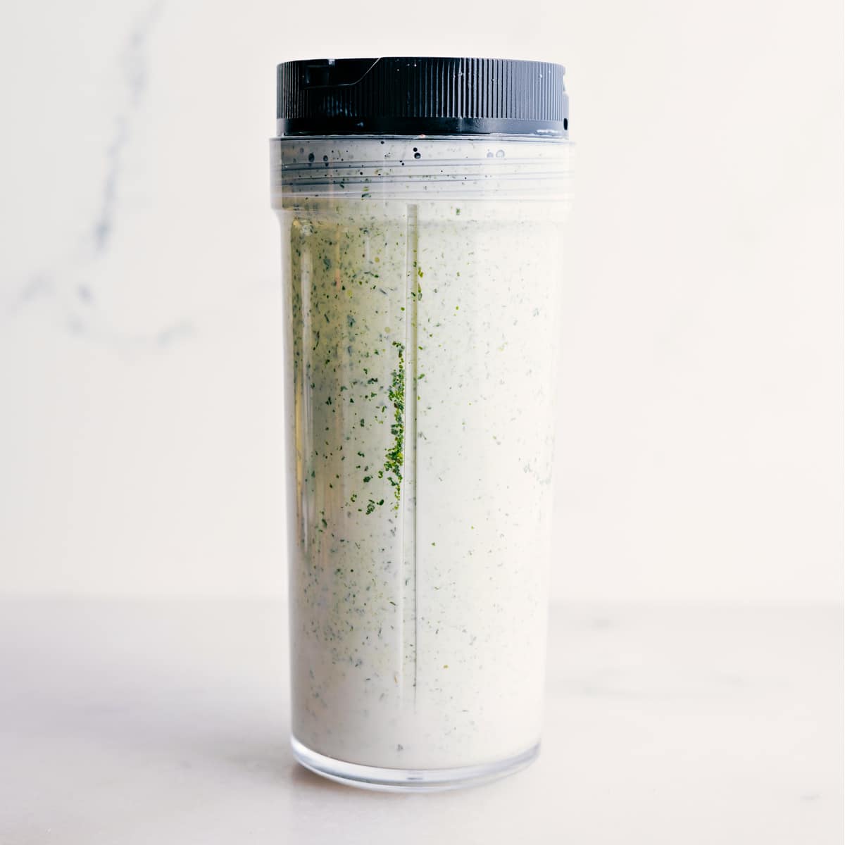 How To Make Green Goddess Dressing The dressing is blended in a blender jar.