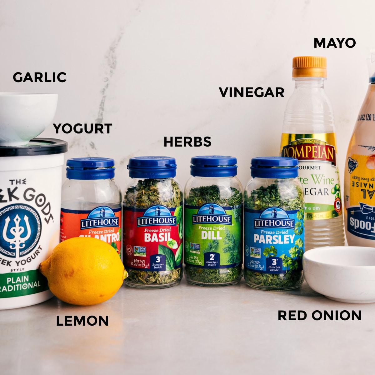 Ingredients In Green Goddess Dressing All the ingredients for this recipe are prepped and ready for easy assembly: mayo, vinegar, herbs, yogurt, and garlic.