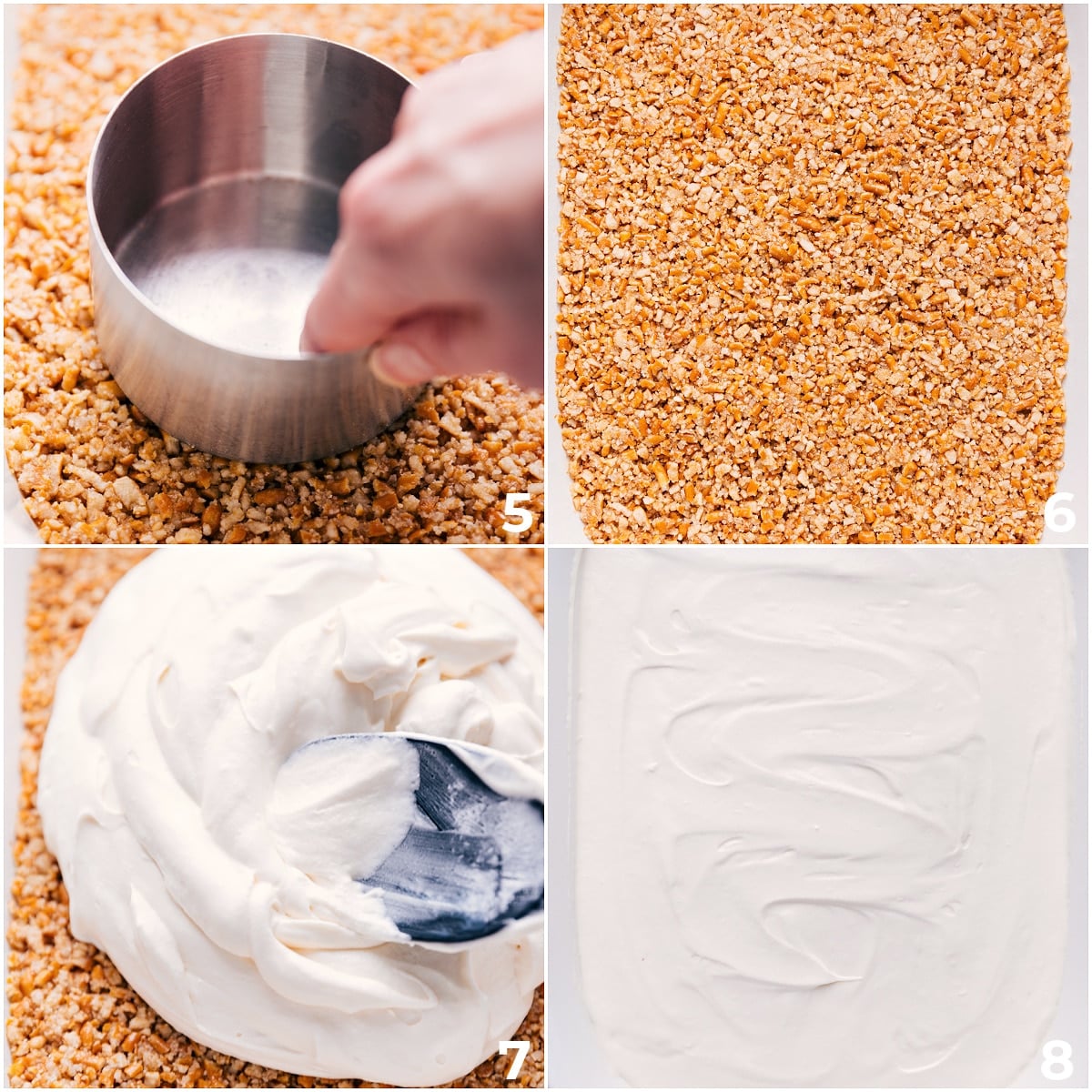 Layering In Cool Whip On the Strawberry Pretzel Salad The whipped cream layer being added on top of the crust.