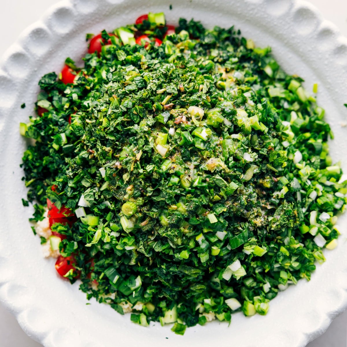 How To Make Tabouli All the ingredients in a bowl, ready to mix and toss with the dressing and enjoyed.