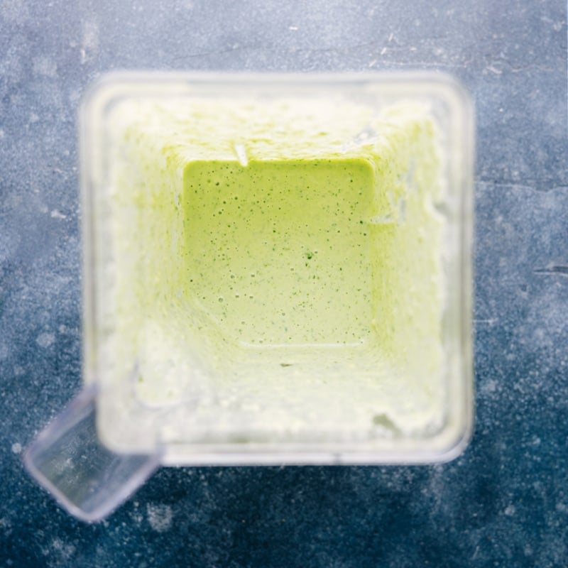 Healthy Cilantro-Lime Dressing is thick, creamy, and ridiculously flavorful! It's hard to believe this sauce is naturally dairy-free, gluten-free, and vegan! Recipe via chelseasmessyapron #salad #dip #best #easy #simple #healthy #cilantrolime #dressing Process shots-- images of the dressing after blending