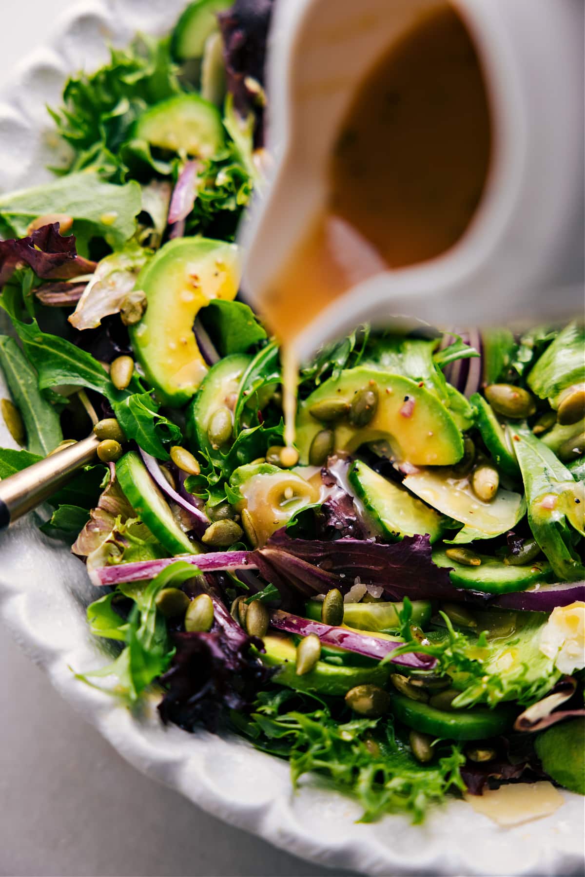 Dressed And Ready To Be Enjoyed Salad Drizzling dressing over this favorite everyday salad.