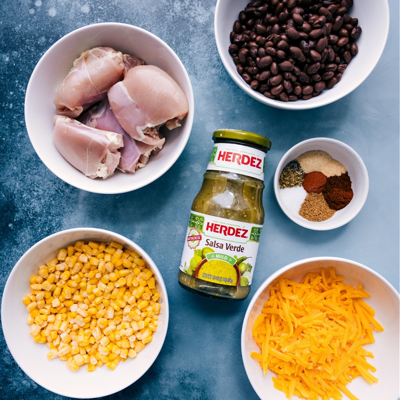 This Salsa Verde Chicken couldn't be easier to make -- throw everything into a pressure cooker and let it do the work! The result? Succulently tender chicken bathed in a deliciously seasoned salsa verde sauce with hearty black beans, crisp corn, and melty Cheddar. Serve the chicken over rice with your favorite toppings. We love sour cream, avocado, cilantro, and lots of fresh lime! Recipe via ChelseasMessyApron #dinner #best #quick #easy #simple #instantpot #salsaverde #chicken Ingredient shot-- image of everything used in this dish