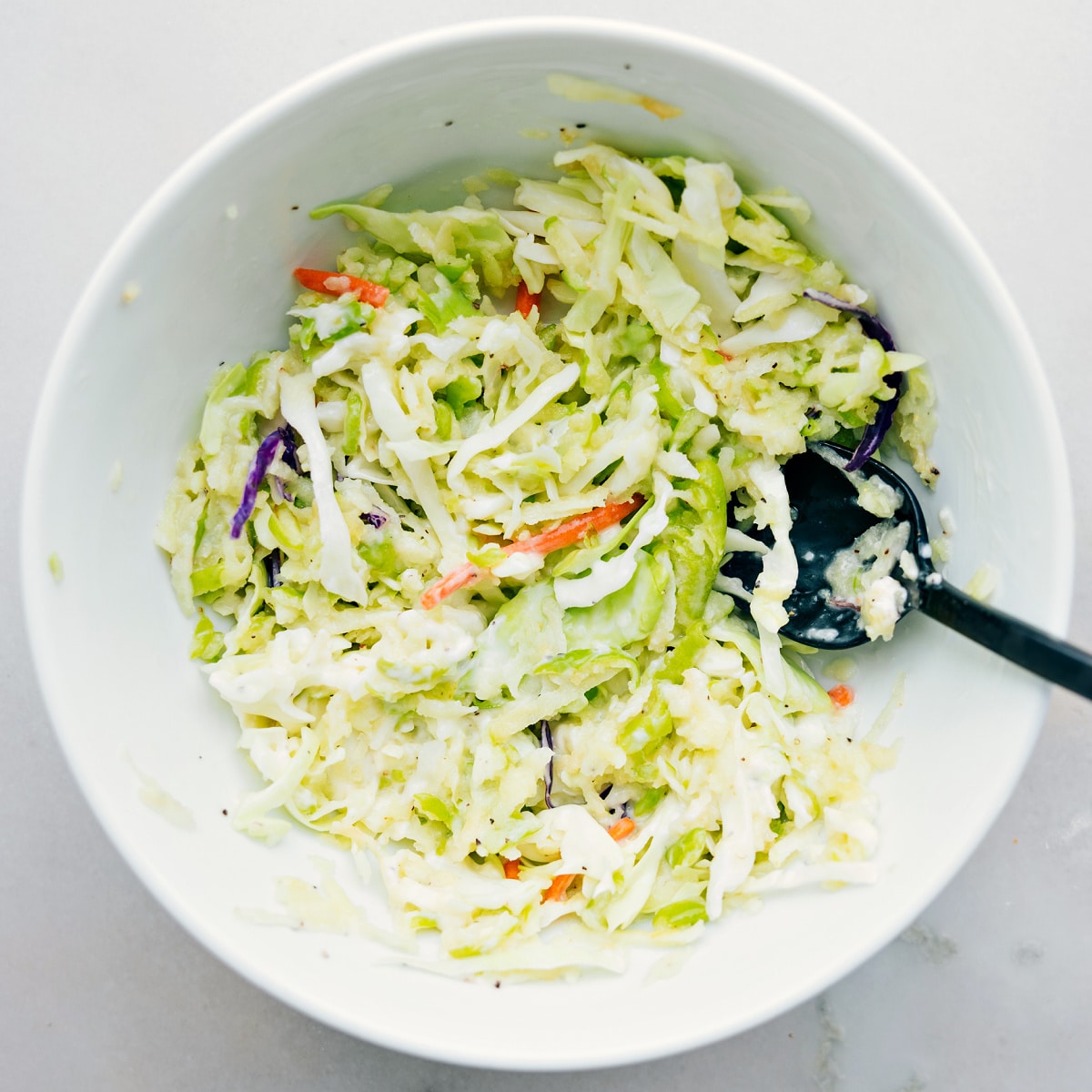 How To Make Healthy Turkey Wraps Mixing together the coleslaw mixture to fill these burritos.