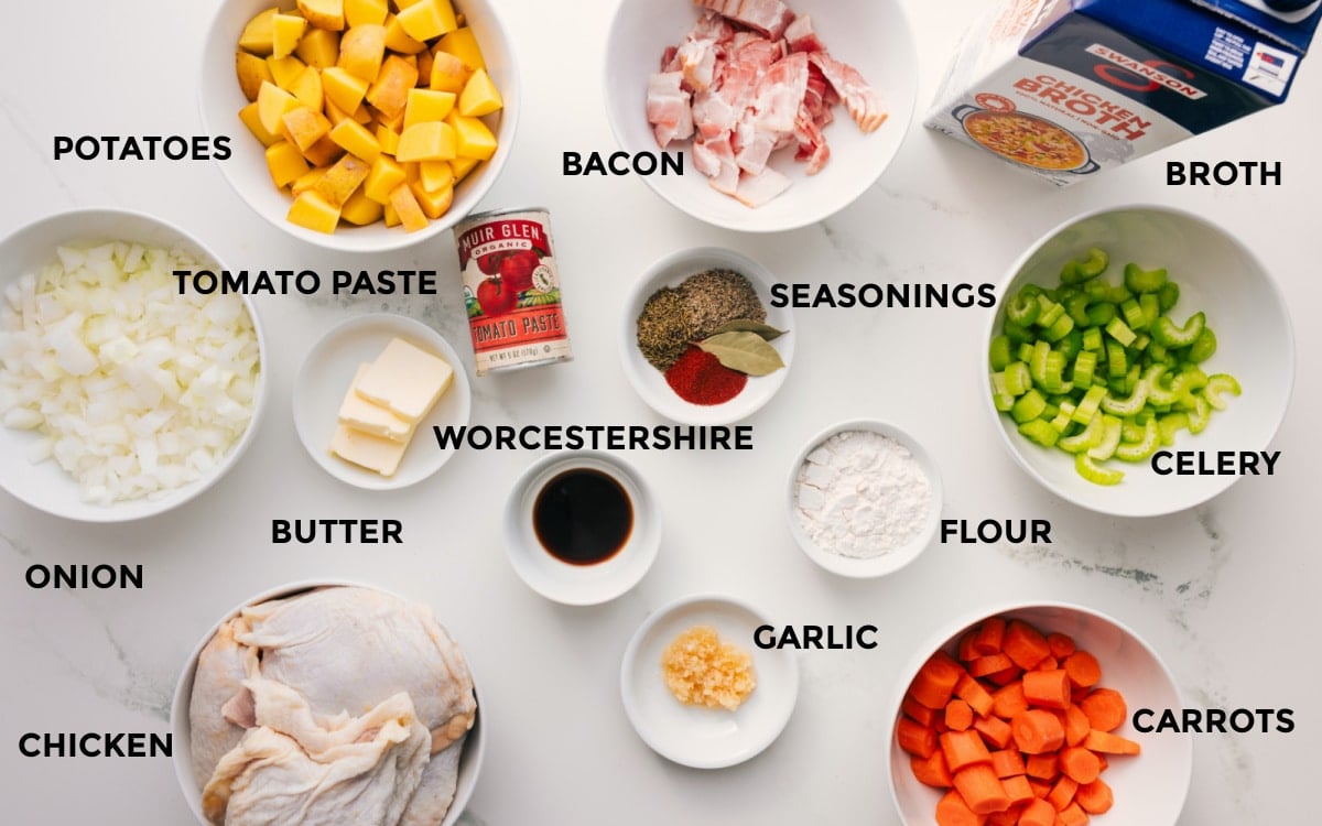 Ingredients In This Chicken Stew Recipe All the ingredients for this dish prepped and ready to assemble, including potatoes, onions, chicken, tomato paste, butter, bacon, seasonings, Worcestershire sauce, garlic, flour, carrots, celery, and broth