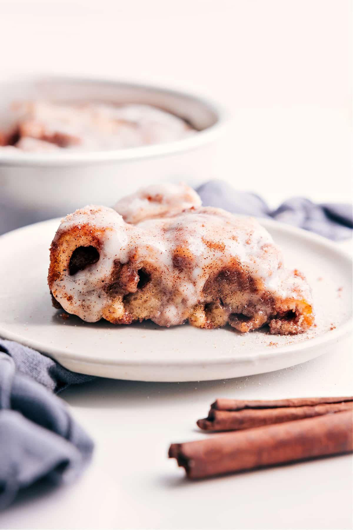 Cinnamon Roll Cake slice on a plate, ready to be served and enjoyed.