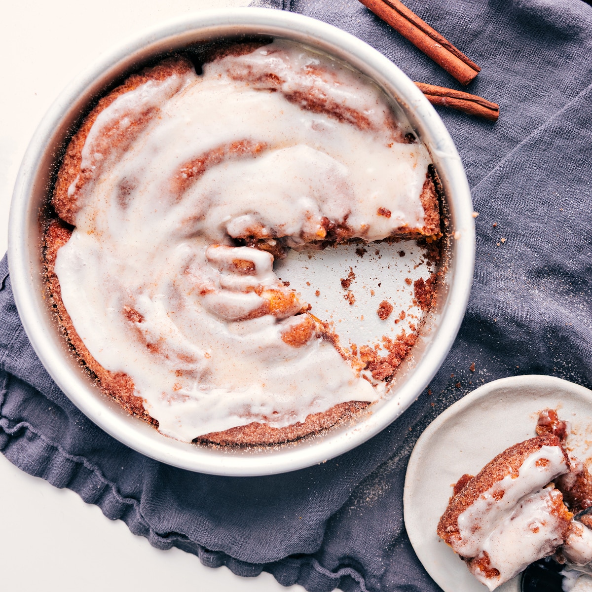 No Yeast And No Rising Time For This Cinnamon Roll Cake Recipe A slice of this cinnamon roll cake recipe taken out of the pan to be enjoyed.