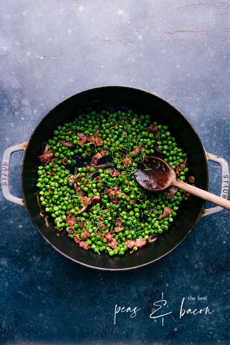 This Frozen Peas recipe is a total show-stopper! With crisp bacon, caramelized shallots, and a touch of garlic--you'll never want frozen peas any other way! Recipe via chelseasmessyapron #sidedish #best #quick #easy #simple #bacon #frozenpeas #recipe Overhead image of Frozen Peas