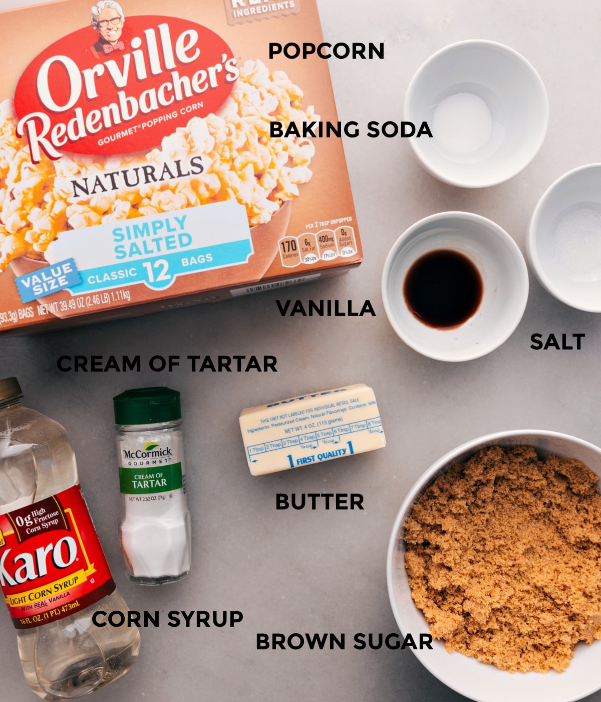 Ingredients In The Best Caramel Corn Recipe All the ingredients for this recipe are prepped for easy assembly: baking soda, salt, vanilla, butter, sugar, corn syrup, cream of tartar, and popcorn.