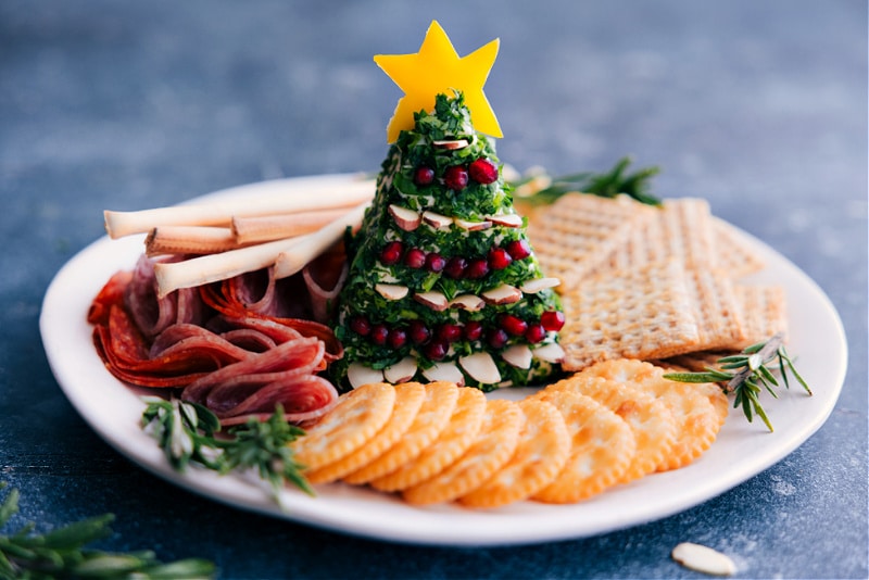 How To Make The Perfect Christmas Appetizer Christmas tree cheese ball snack plate ready to be enjoyed.
