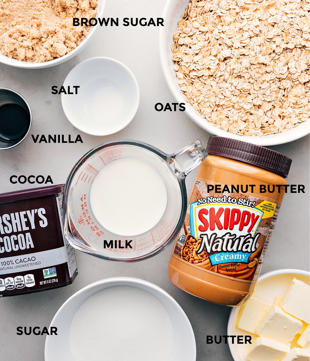 Ingredients In No Bake Cookies Ingredients in this recipe including oats, salt, peanut butter, vanilla, cocoa, and brown sugar prepped for easy assembly.