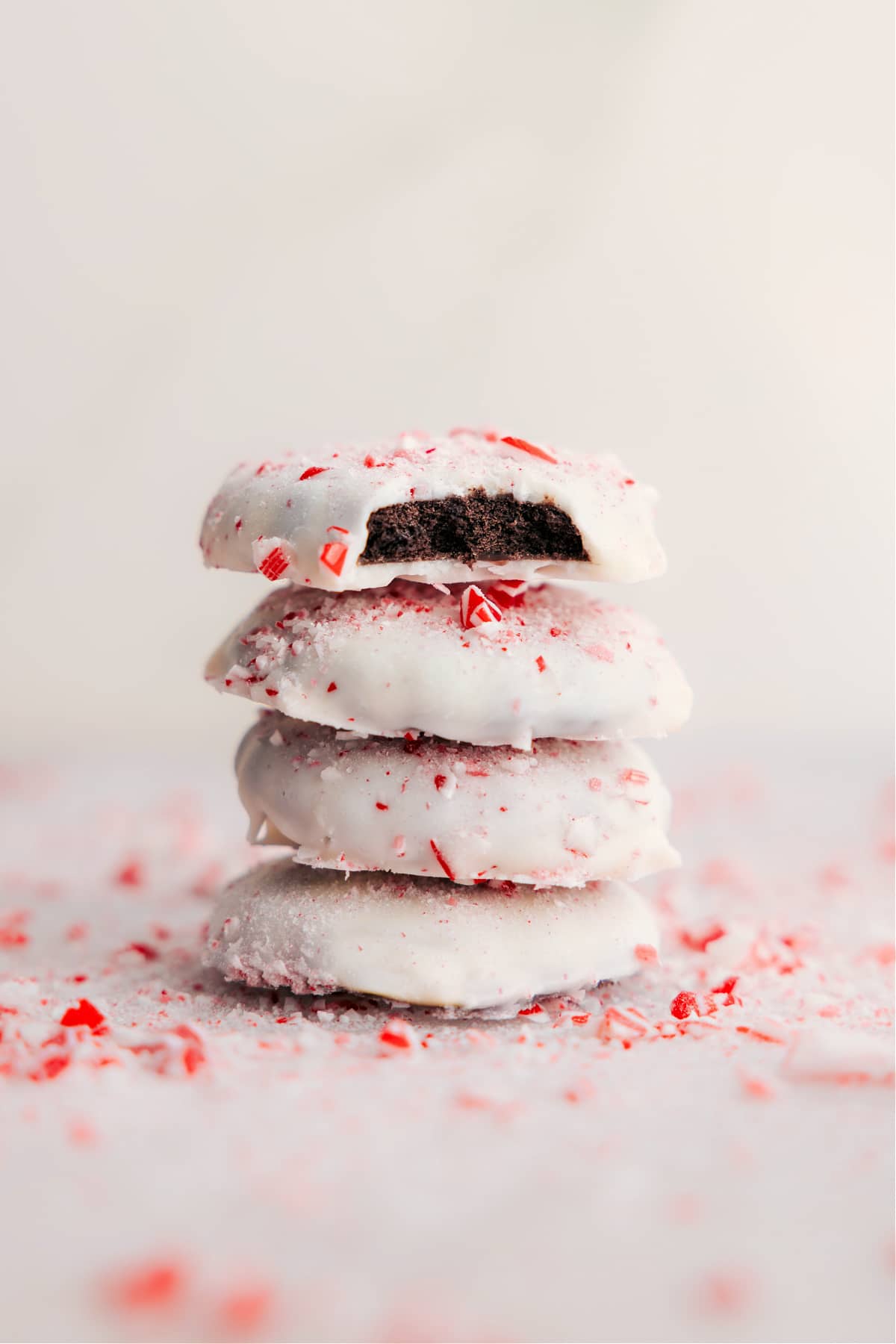 Four-Ingredient Peppermint Cookies Recipe Stacked Peppermint Cookies with a bite missing from one.