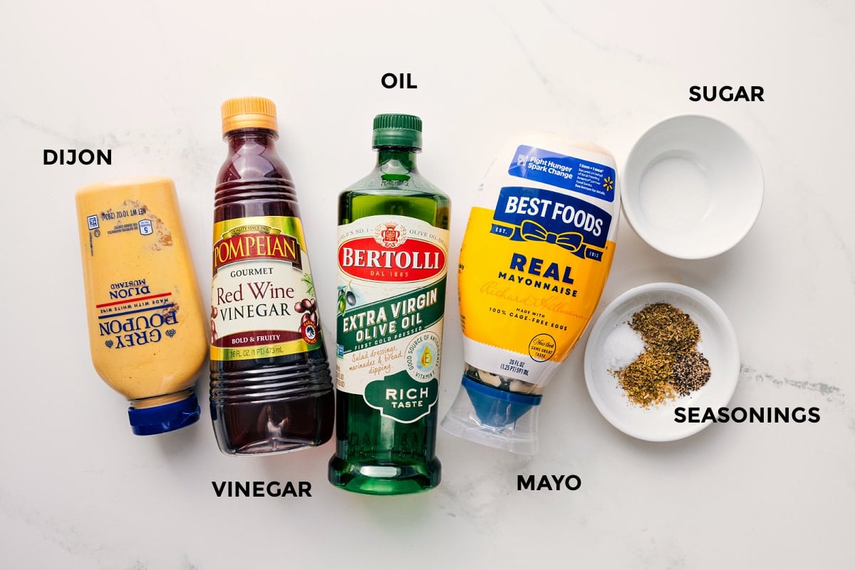 All The Ingredients In The Dressing For This Olive Garden Salad Recipe All the dressing ingredients in this Olive Garden salad recipe prepped out including the dijon, vinegar, oil, mayo, seasonings, and sugar.