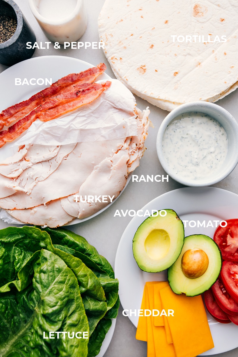 With just a few simple ingredients, you can whip up these tasty and nutritious Turkey Wraps that both kids and adults will love. And best of all, they taste absolutely incredible! Packed with smoky deli turkey, sharp Cheddar cheese, fresh lettuce, juicy tomatoes, and creamy avocado, these wraps are the perfect balance of flavors and textures. Recipe via chelseasmessyapron #lunch #quick #easy #simple #best #familyfriendly #kidfriendly #healthy #nobake #kidfriendly #turkey #wraps Ingredient shot-- image of all the ingredients used in this dish