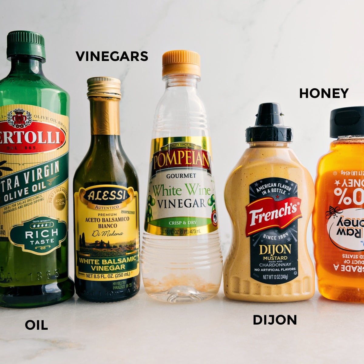 Ingredients In White Balsamic Vinaigrette Recipe All the dressing ingredients are prepped and ready to mixโolive oil, balsamic vinegar, white wine vinegar, Dijon, and honey.