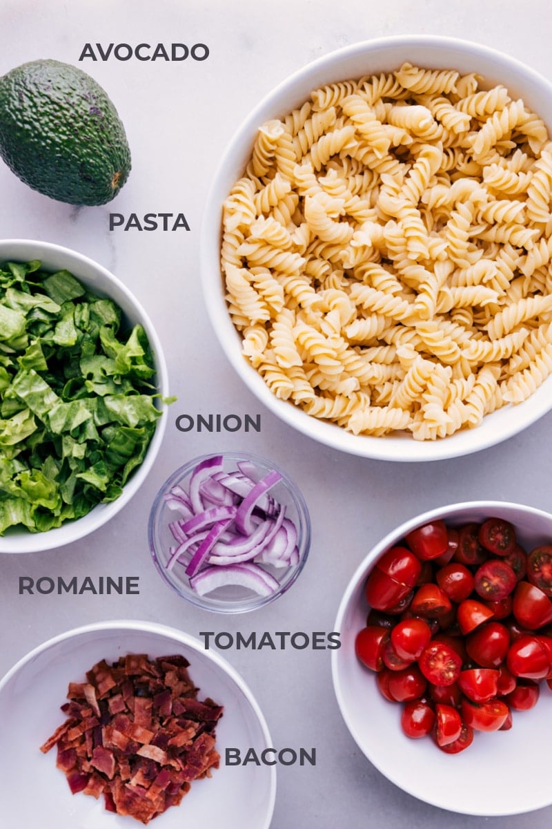 This BLT Pasta Salad is a fresh and delicious twist on the classic BLT sandwich. The vibrant avocado-ranch dressing is nothing short of addicting and ties everything together perfectly! Recipe via chelseasmessyapron #dinner #quick #easy #simple #familyfriendly #kidfriendly #comfortfood #bbq #sidedish #tomatoes #bacon #onions #BLT #pastasalad Ingredient shot-- image of all the ingredients used in this dish