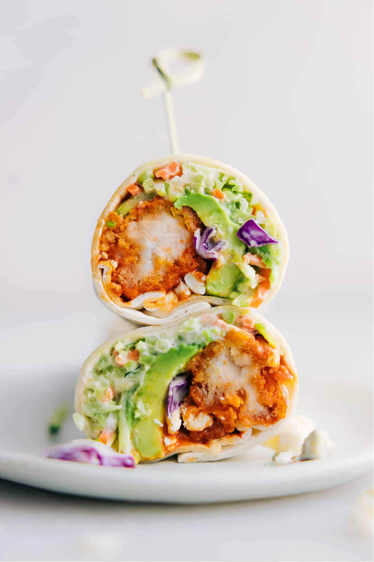 Buffalo Chicken Wraps cut in half and stacked on top of each other ready to be enjoyed.