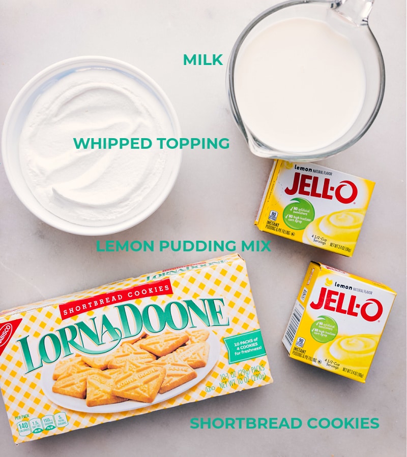 This Lemon Icebox Cake recipe is easy to make, delicious, and perfect for really any occasion! But don't let its simplicity fool you--the combination of sweet lemon pudding with buttery shortbread cookies is nothing short of amazing! #dessert #best #quick #easy #simple #familyfriendly #treat #spring #nobake #nobakedessert #lemon #icebox #cake Ingredient shot-- image of all the ingredients used in this recipe