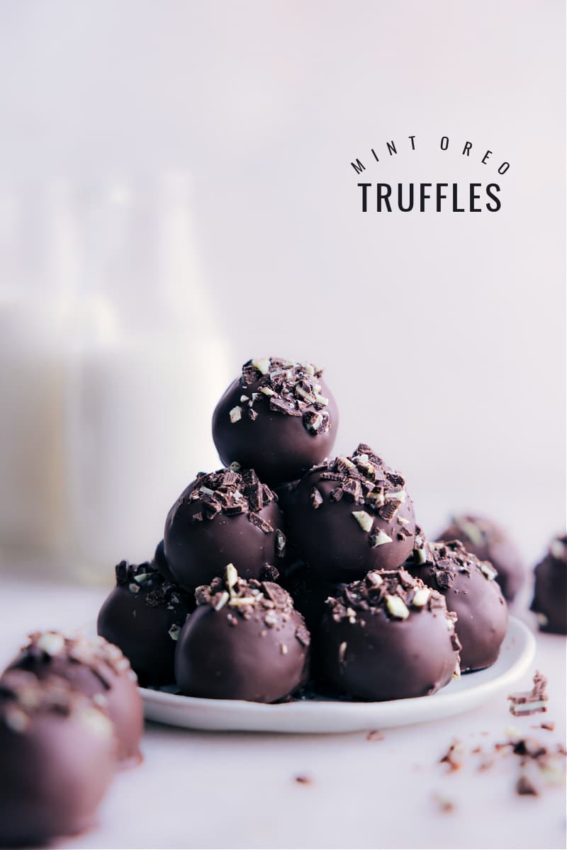 Decadent and irresistibly delicious Mint Oreo Truffles made with just three main ingredients and no baking required! With a rich, creamy, and minty Oreo filling coated in a smooth layer of chocolate, every bite is pure bliss. And if you're a fan of Andes mints, you won't want to sleep on the optional garnish of chopped mints on top! Recipe via chelseasmessyapron #dessert #best #quick #easy #simple #treat #chocolate #stpatricksday #mint #oreotruffles Image of the Mint Oreo Truffles stacked on top of each other