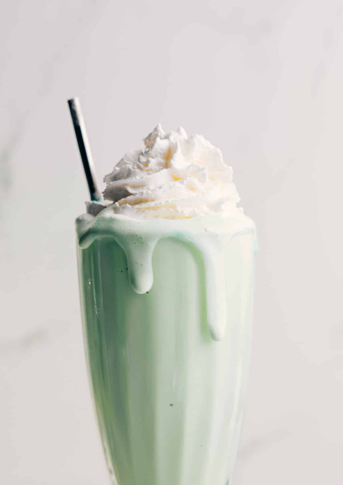 Thick And Creamy Shamrock Shake Shamrock Shake topped with fresh whipped cream.