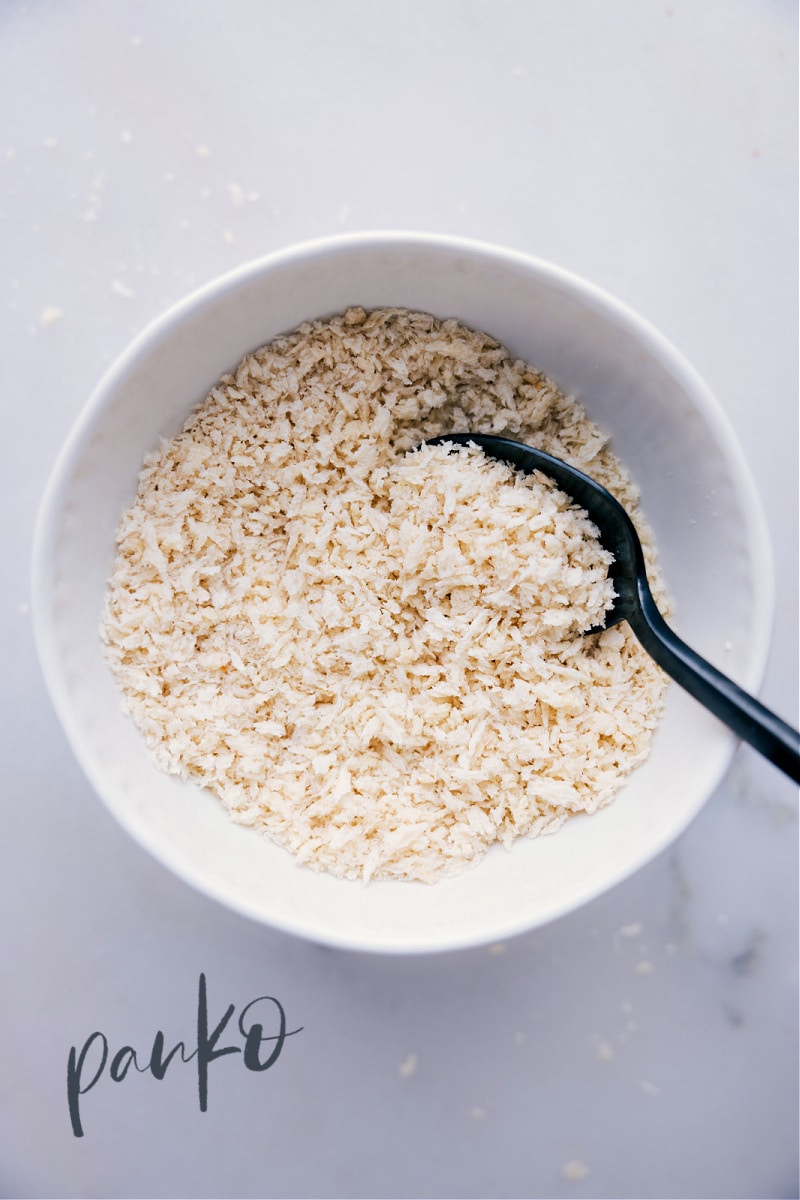 If you think the best part of a casserole is the crunchy crumb toppings, find out how to get them even crunchier with panko! If youโve never tried these extra-crispy bread crumbs, read on to see why theyโre a cookโs best friend! Guide via ChelseasMessyApron.com #panko #userguide #guide #breadcrumbs #Japanese #bread #crispy Image of panko in a bowl.