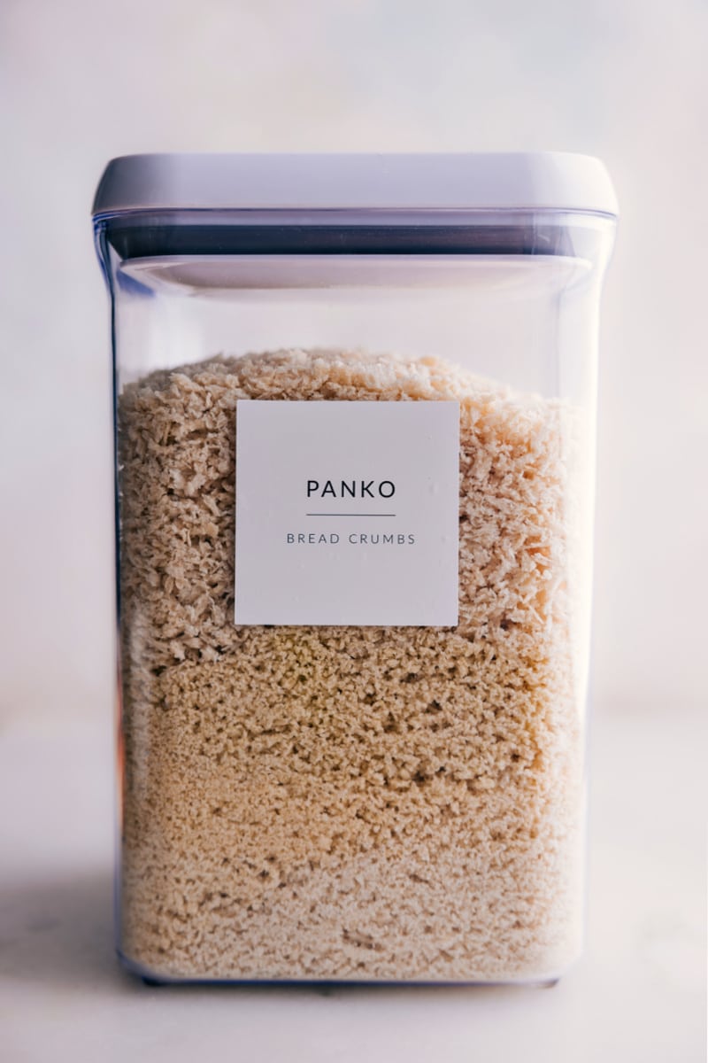 If you think the best part of a casserole is the crunchy crumb toppings, find out how to get them even crunchier with panko! If youโve never tried these extra-crispy bread crumbs, read on to see why theyโre a cookโs best friend! Guide via ChelseasMessyApron.com #panko #userguide #guide #breadcrumbs #Japanese #bread #crispy A container of panko bread crumbs