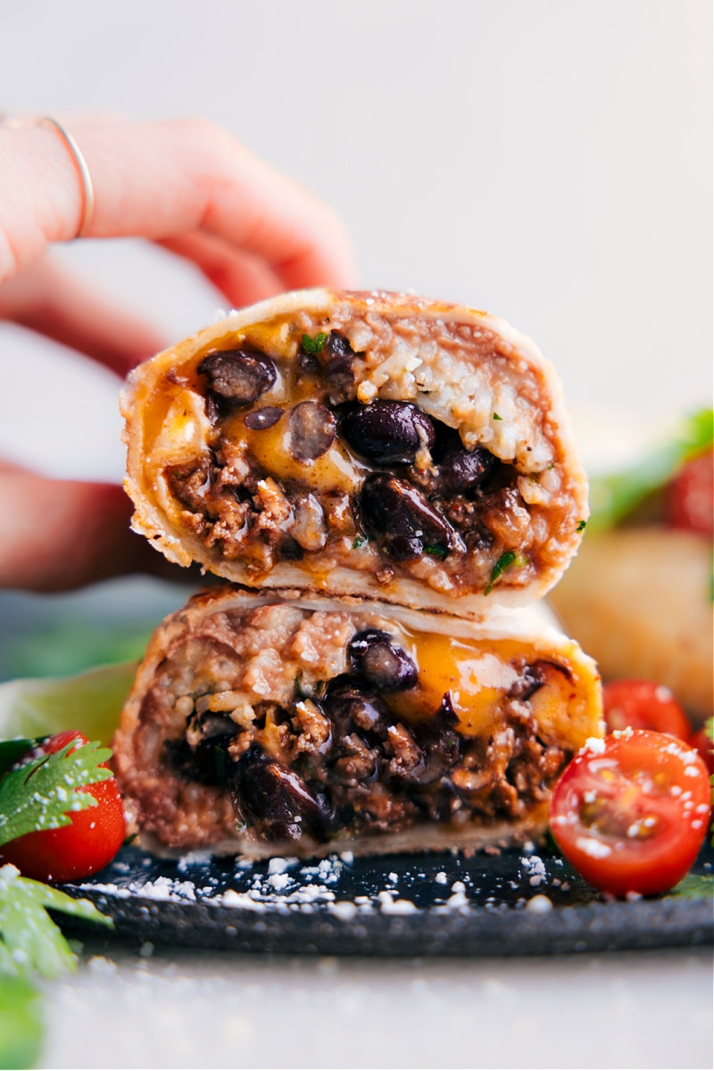 Image of the Beef Burrito Recipe cut in half, with the halves stacked on top of each other 