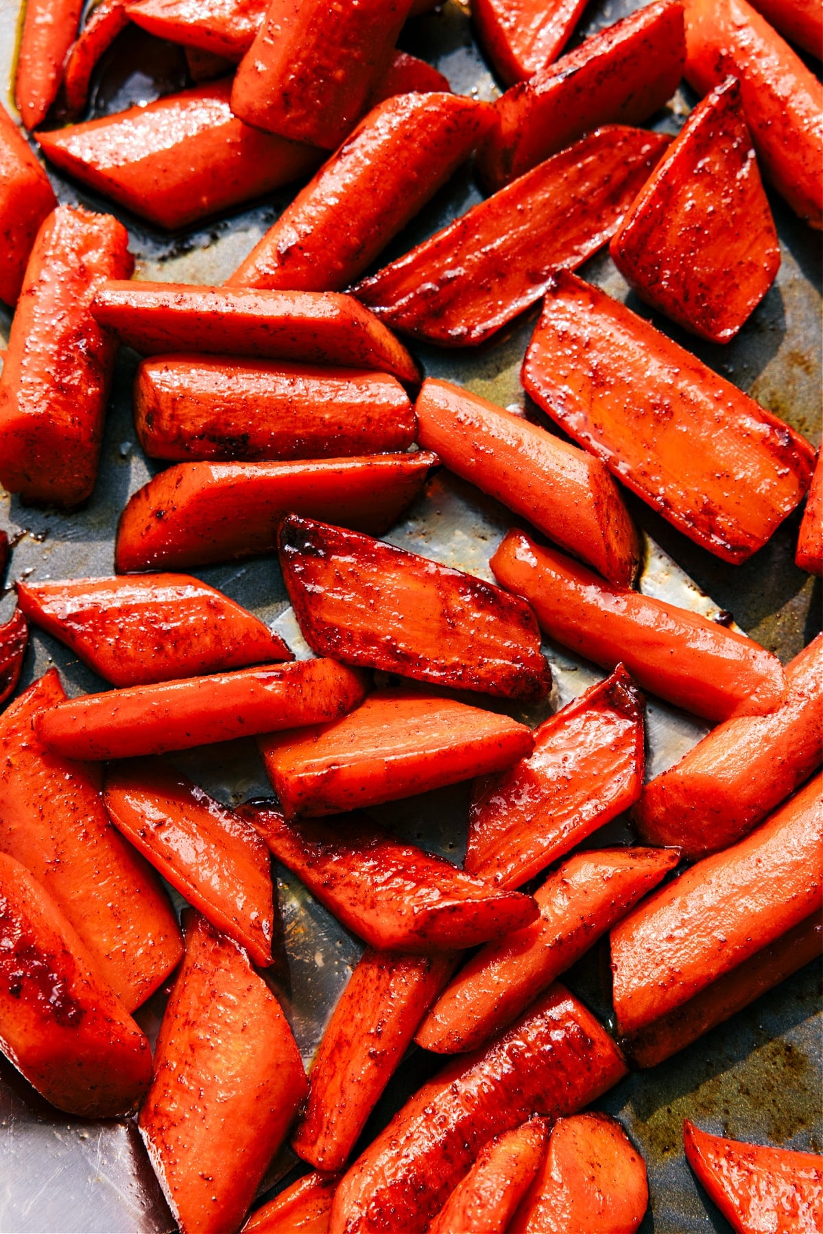 The Best Brown Sugar Roasted Carrots Brown Sugar Roasted Carrots on the sheet pan ready to be enjoyed.