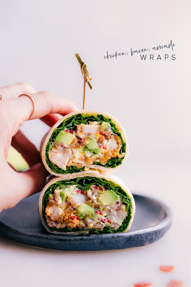These Chicken Bacon Avocado Wraps are the perfect quick and easy meal that is packed with flavor! With tender chicken, crispy bacon, creamy avocado, and a completely irresistible sauce, these wraps are incredible! Plus, they're so easy to make that you can whip them up in just a few minutes for a delicious lunch or dinner. Recipe via chelseasmessyapron #dinner #lunch #quick #easy #simple #familyfriendly #kidfriendly #healthy #wholefoods #lunch #chicken #bacon #avocado #tortillawraps #wraps #lunchwraps Image of the Chicken Bacon Avocado Wraps stacked on top of each other