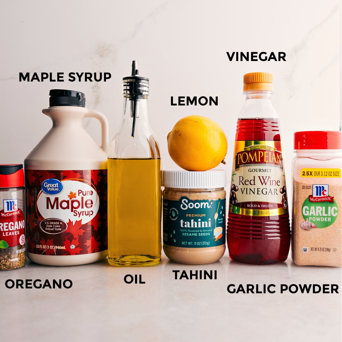 The Best Dressing To Top Your Grain Bowl The dressing ingredients for the grain bowlโmaple syrup, seasonings, lemon, tahini, and vinegarโare prepped for easy assembly.