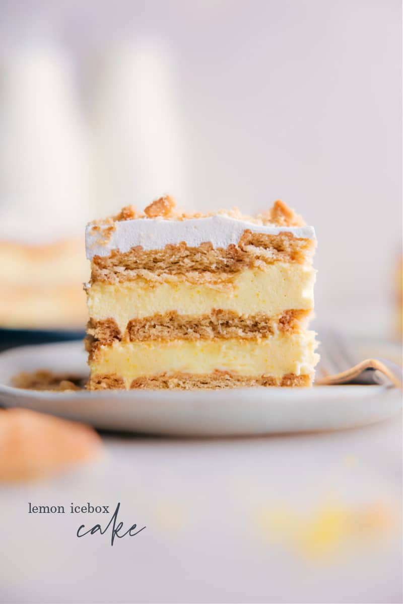 This Lemon Icebox Cake recipe is easy to make, delicious, and perfect for really any occasion! With just a handful of ingredients and minimal prep work, this cake is a breeze to put together. But don't let its simplicity fool you--the combination of sweet lemon pudding with buttery shortbread cookies is nothing short of amazing! #dessert #best #quick #easy #simple #familyfriendly #treat #spring #nobake #nobakedessert #lemon #icebox #cake Image of a slice of Lemon Icebox Cake