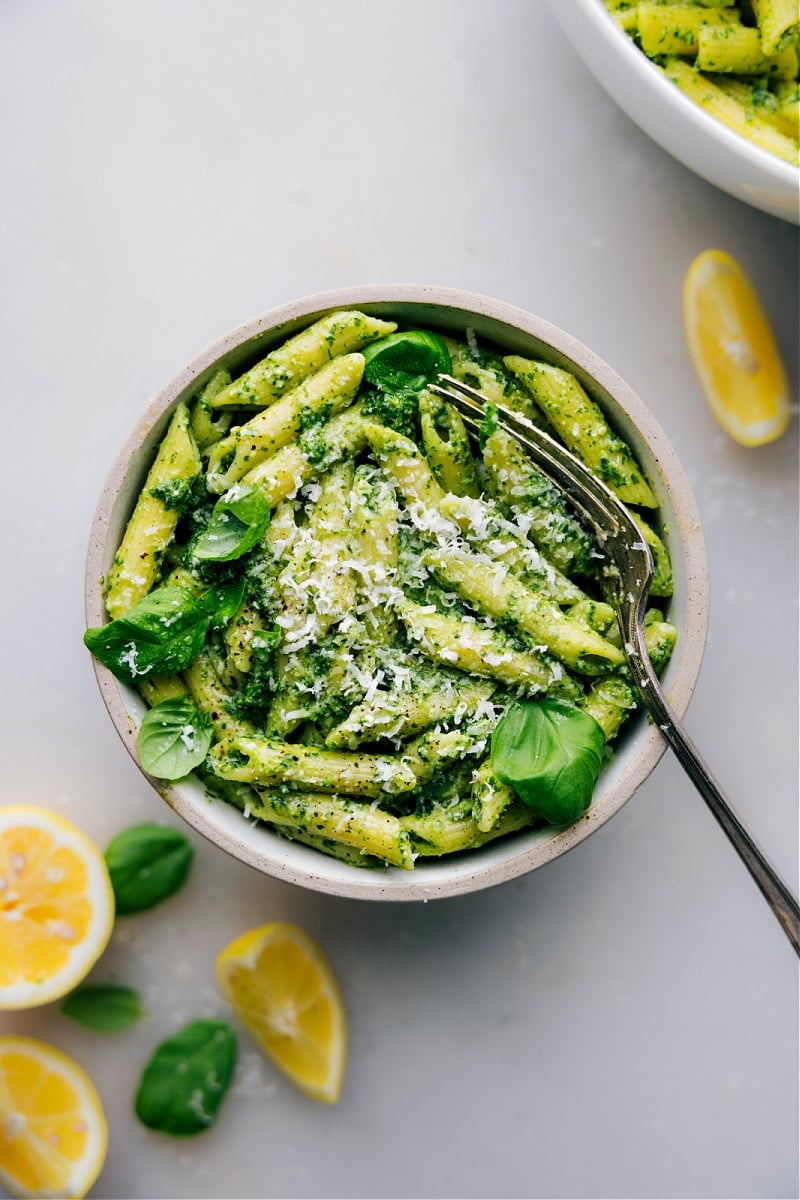 20-Minute Pesto Pasta Easy Dinner Recipes: Pesto pasta in a bowl topped with freshly grated parmesan.