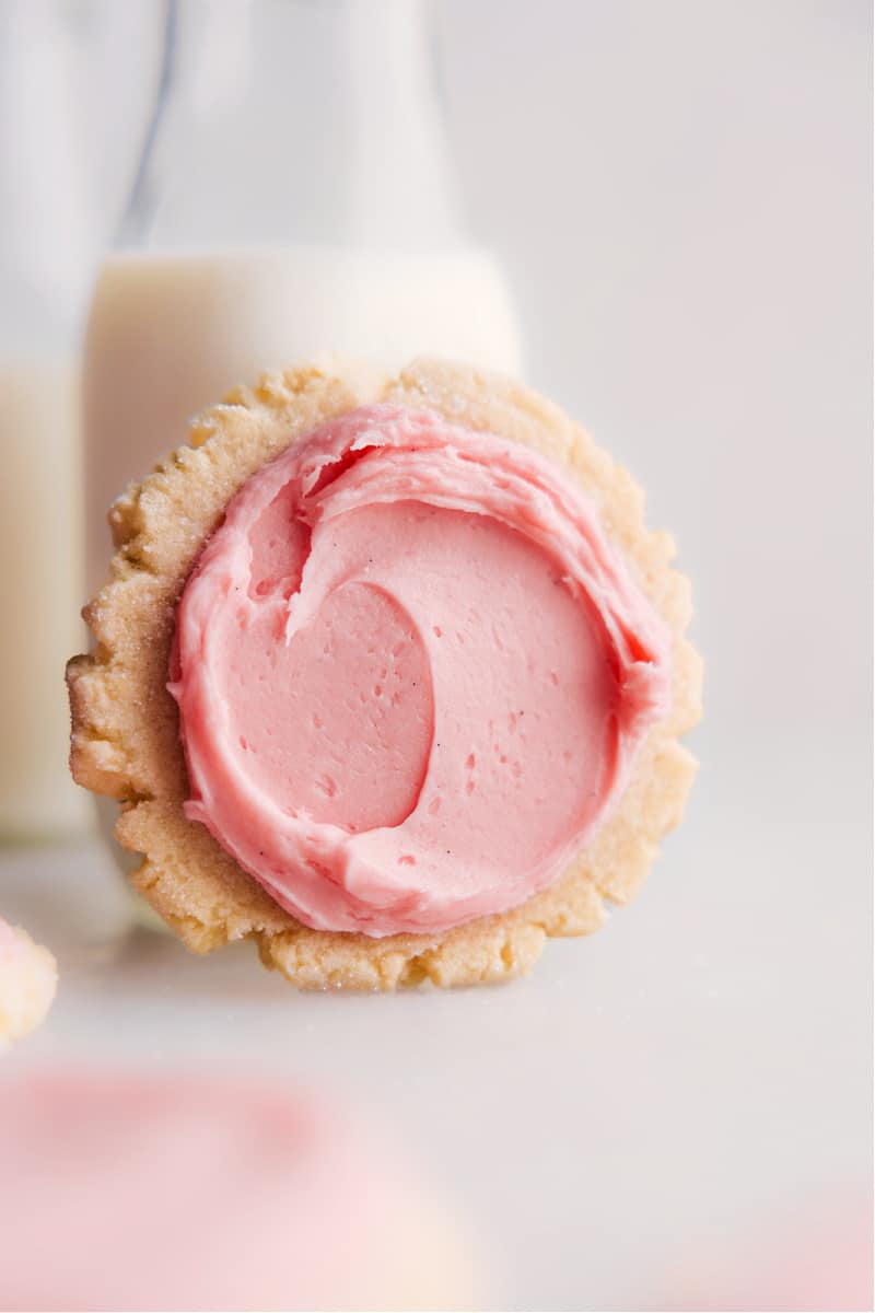 These homemade Swig Sugar Cookies are a delightful twist on traditional sugar cookies. With a unique combination of baking soda and cream of tartar, these cookies have a soft, chewy, and thick texture. Plus, they're topped with a generous layer of frosting, making them the best treat! Recipe via chelseasmessyapron #dessert #best #quick #easy #simple #treat #swig #sugarcookies image of the Swig Sugar Cookies