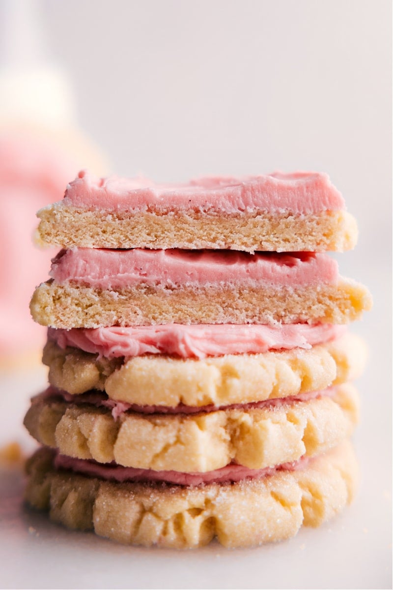 These Swig Sugar Cookies are a delightful twist on traditional sugar cookies. With a unique combination of baking soda and cream of tartar, these cookies have a soft, chewy, and thick texture. Plus, they're topped with a generous layer of frosting, making them the best treat! Recipe via chelseasmessyapron #dessert #best #quick #easy #simple #treat #swig #sugarcookies Image of the dessert ready to be enjoyed
