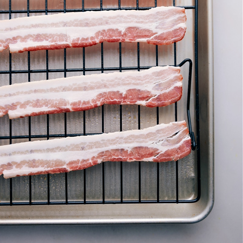 Bacon is one of the most beloved foods of all time. While most people fry their bacon on the stove, baking it is actually a great alternative that yields perfect results every time. Today, weโll provide you with a step-by-step guide on How To Bake Bacon to perfection! Recipe via chelseasmessyapron #sidedish #breakfast #best #quick #easy #simple #brunch #onepan #howtobake #bacon Process shots-- images of the strips of bacon on a tray