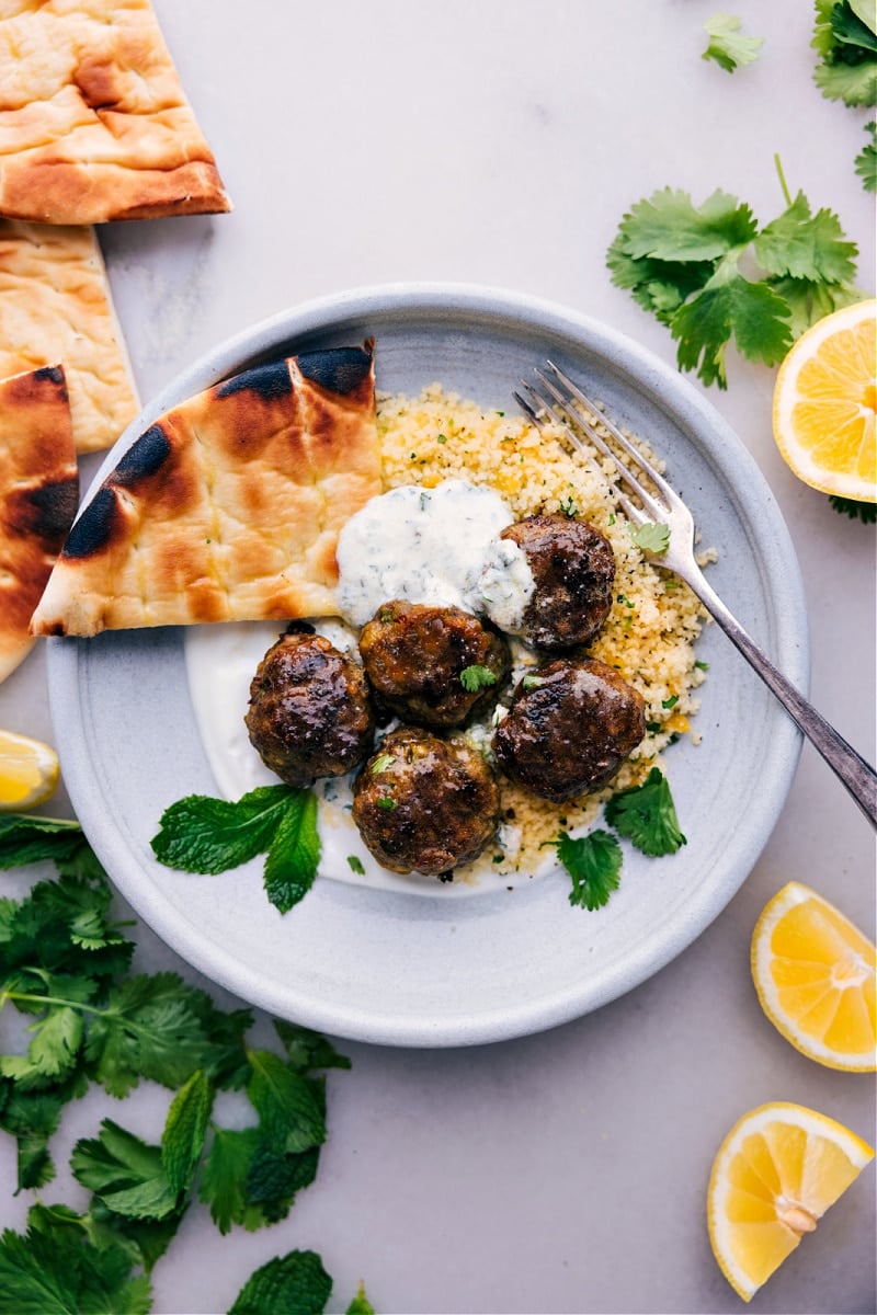 Beef Kofta Recipe On A Plate Beef kofta recipe with mint yogurt sauce and veggies.
