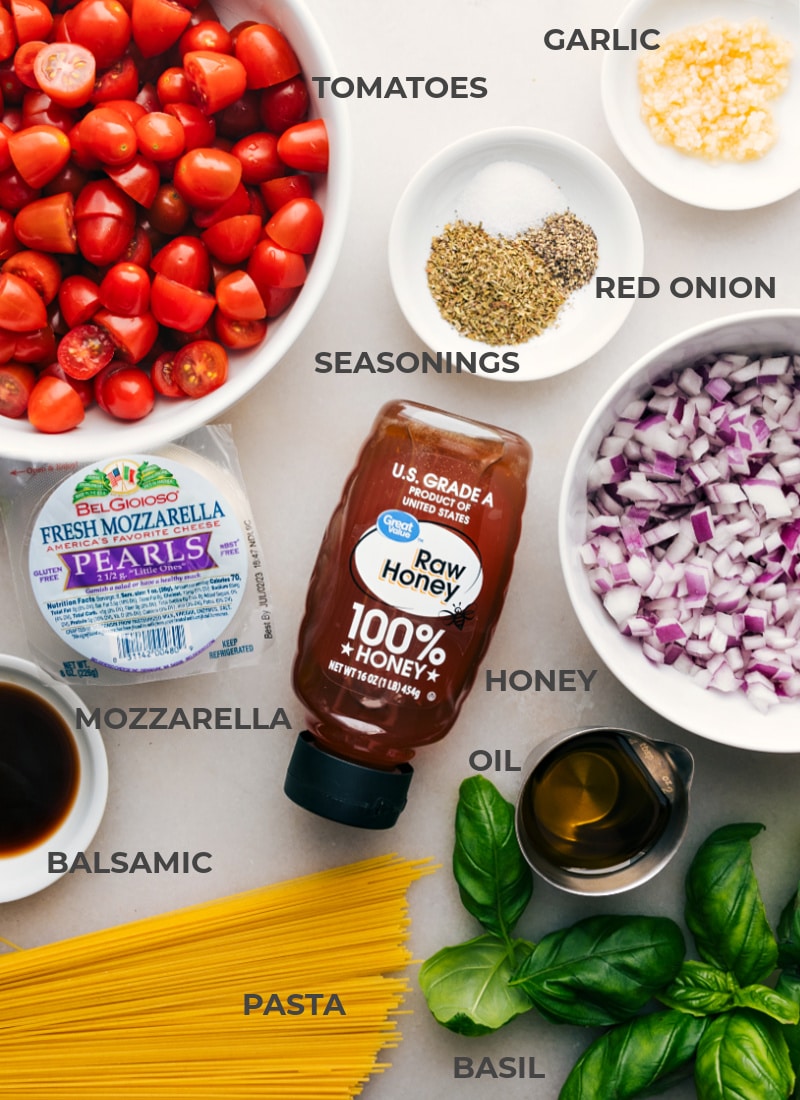 This Caprese Pasta begins with a sauce combining sweet cherry tomatoes, onions, and a hint of garlic. Recipe via chelseasmessyapron #dinner #quick #easy #simple #familyfriendly #kidfriendly #comfortfood #tomatoes #basil #pesto #caprese #pasta Ingredient shot-- image of all the ingredients used in this dish