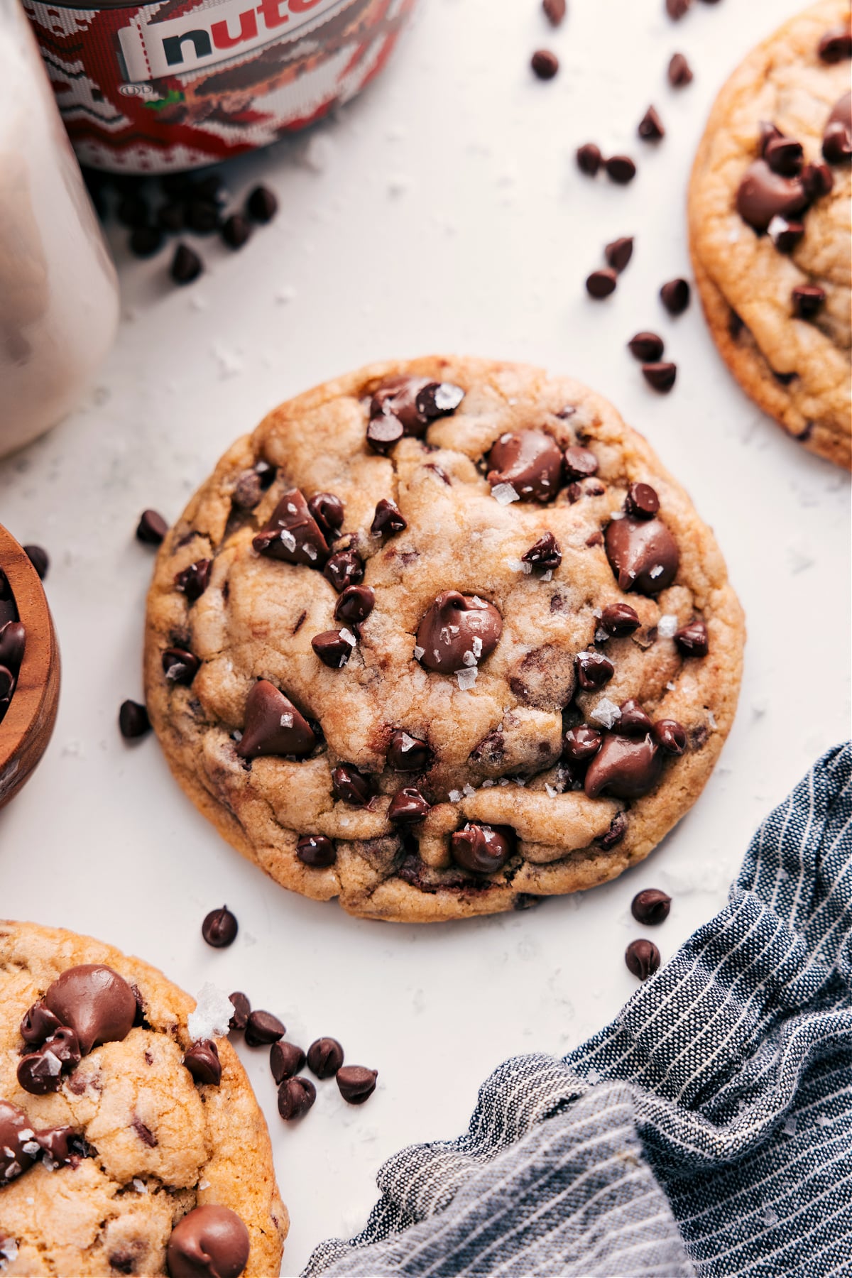 The Ultimate Chocolate Chip Cookie: Nutella Stuffed Some Nutella stuffed chocolate chip cookies fresh out of the oven with flaky sea salt on top.