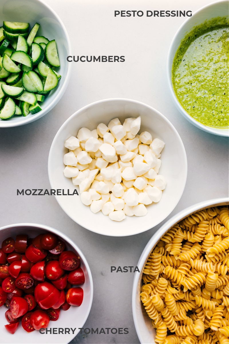 This irresistible Pesto Pasta Salad combines rotini pasta, juicy cherry tomatoes, crisp cucumbers, and creamy mozzarella pearls, all tossed in a luscious, herbaceous basil pesto dressing. This salad is easy to make and sure to be a hit wherever it's served! Recipe via chelseasmessyapron #dinner #quick #easy #simple #familyfriendly #kidfriendly #sidedish #noodles #bbq #pesto #pastasalad Ingredient shot-- image of all the ingredients used in this dish
