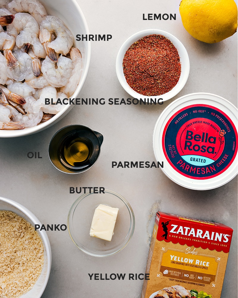 Ingredients In Blackened Shrimp Recipe All the ingredients in this recipe prepped out for easy assembly including the shrimp, lemon, seasoning, parmesan, oil, butter, yellow rice, and panko.